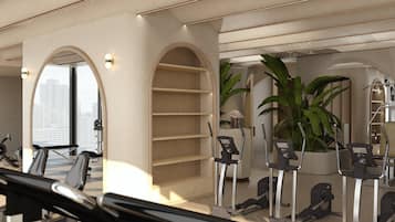 Ein modernes Hotelzimmer mit Blick auf die Stadt, einer großen Pflanze und Fitnessgeräten.