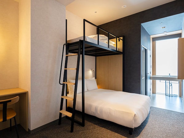 A bunk bed with a ladder, a desk, and a lamp in a modern room with a large window. - AKABANEHOLIC HOTEL (Tokyo)