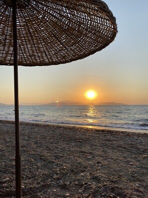Private beach, black sand, sun-loungers, beach umbrellas
