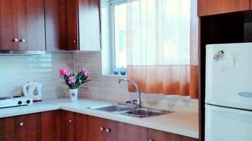 Apartment, 2 Bedrooms, Balcony | Private kitchen | Fridge, toaster, toaster oven, cookware/dishes/utensils