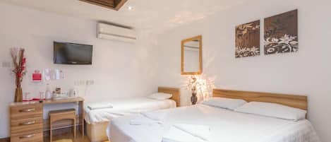 Economy Triple Room | Desk, iron/ironing board, free WiFi, bed sheets