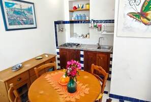 Fridge, stovetop, cookware/dishes/utensils, dining tables - Simple Cozy family apartment in villa with pool (Pantelleria)