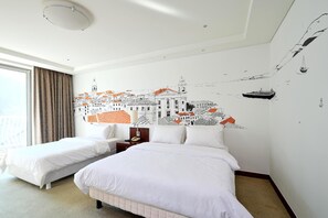 A hotel room with two beds, a large window with curtains, a wall mural, and a ceiling light. - Adonis Hotel (Agios Vasileios)