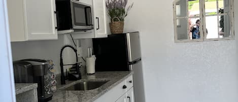 Microwave, coffee/tea maker, cookware/dishes/utensils