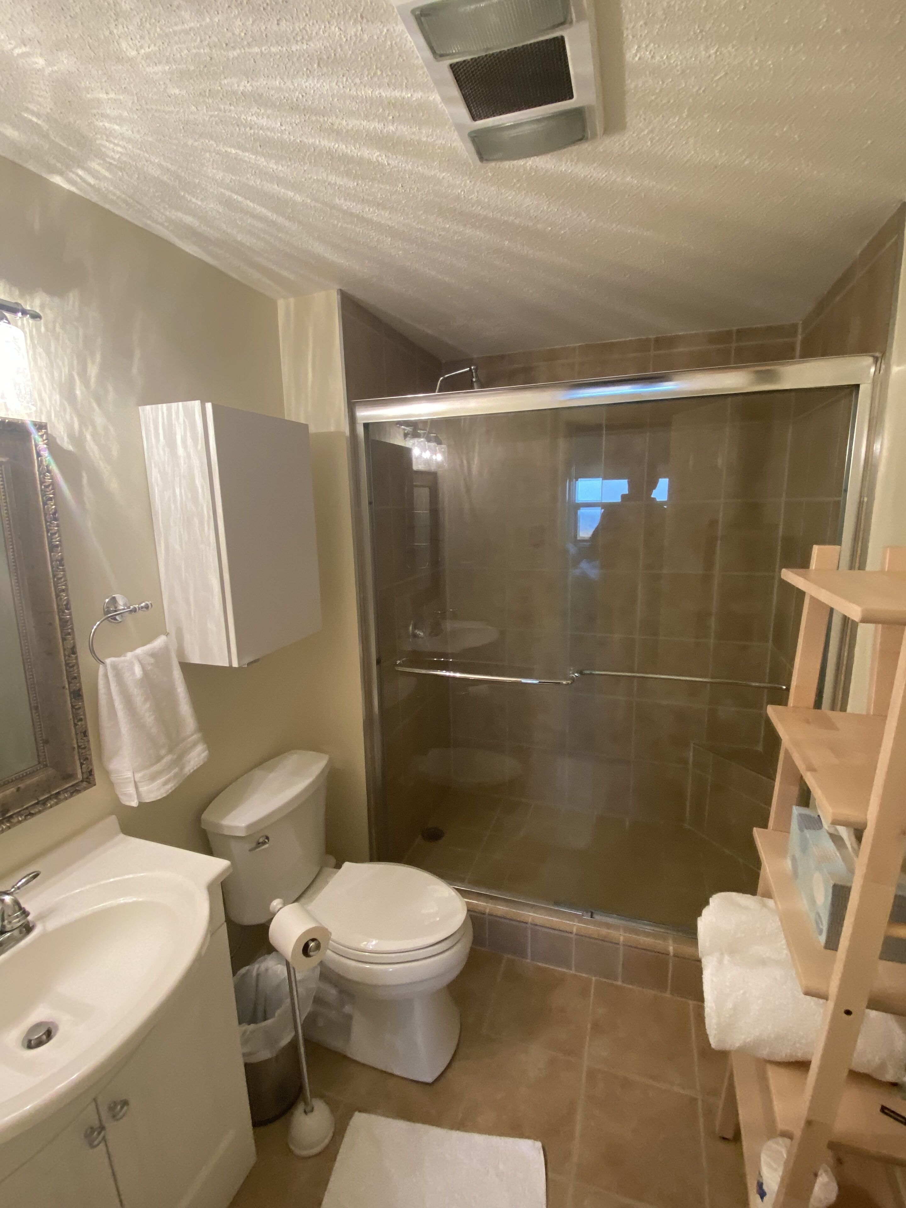 Bathtub, towels, soap, toilet paper