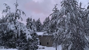 A snow-covered landscape with a house in the background. - 5 bedroom home in Paradise!!  4 miles from Tahquamenon Falls (Paradise)