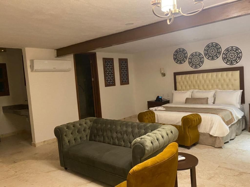 junior suite, 1 king bed | 2 bedrooms, in-room safe, desk, iron/ironing board