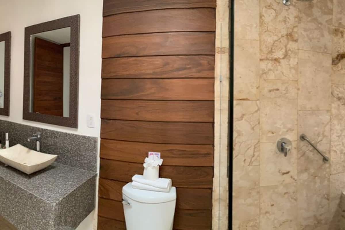 junior suite, 1 king bed (jacuzzi) | bathroom | shower, towels