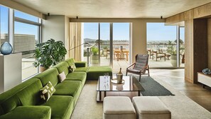 Penthouse (Skyline Penthouse) | Living area | 55-inch LCD TV with satellite channels, TV, Netflix - Conrad Los Angeles (Los Angeles)