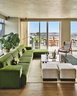 Penthouse (Skyline Penthouse) | Living area | 55-inch LCD TV with satellite channels, TV, Netflix - Conrad Los Angeles (Los Angeles)