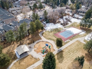 Residents can enjoy a playground with a basketball court, slide, and swing set.