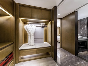 A modern bathroom with a walk-in shower, marble flooring, and a vanity with a marble countertop. - Swissotel Shenyang (Shenyang)