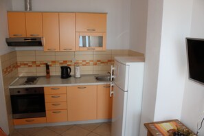 Fridge, oven, electric kettle, cookware/dishes/utensils