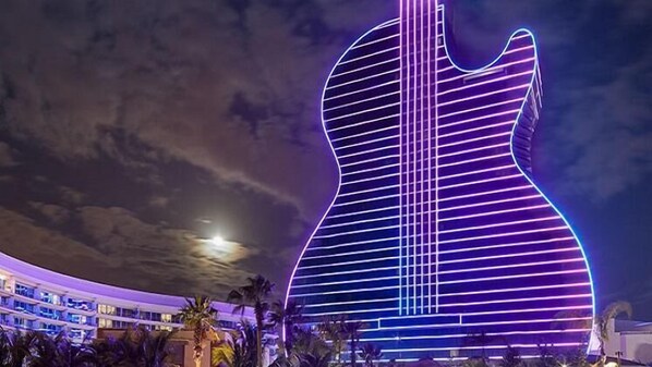 A large illuminated guitar sculpture.