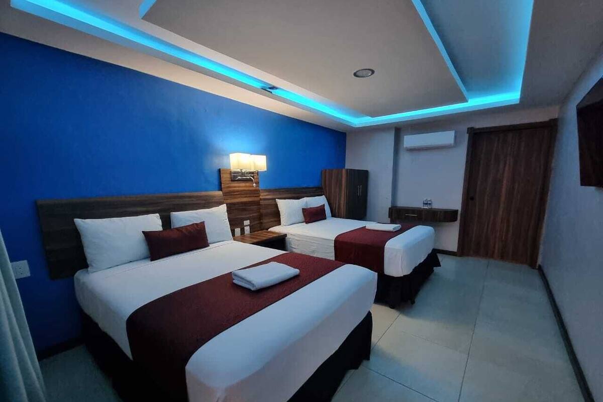 Standard Double Room, 2 Queen Beds, Ensuite | Desk, laptop workspace, WiFi (free), individually decorated