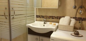 Shower, hair dryer, towels, soap