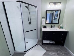 Combined shower/tub, hair dryer, towels, toilet paper