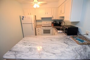 Coffee/tea maker, fridge, microwave, oven