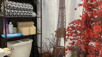 Combined shower/tub, hair dryer, towels, soap
