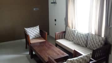 Family Apartment | Living area | 21-inch Smart TV with satellite channels, TV