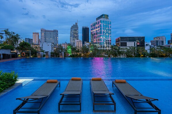 Outdoor pool, open 7:00 AM to 8:00 PM, pool umbrellas, pool loungers