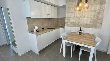 Fridge, microwave, stovetop, coffee/tea maker