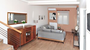 Una sala de estar moderna con un sofá gris, un armario de madera y una escalera.