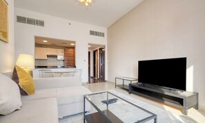 Luxury Apartment | Living area | 43-inch Smart TV with cable channels, TV