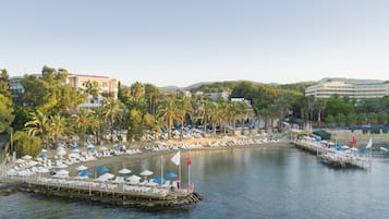 Private beach, free beach shuttle, sun loungers, beach umbrellas