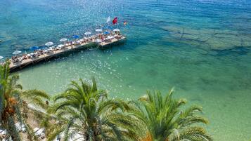 Private beach, free beach shuttle, sun loungers, beach umbrellas
