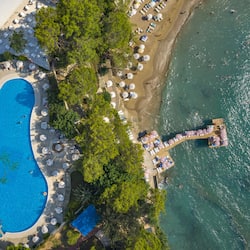 Indoor pool, seasonal outdoor pool, pool umbrellas, pool loungers