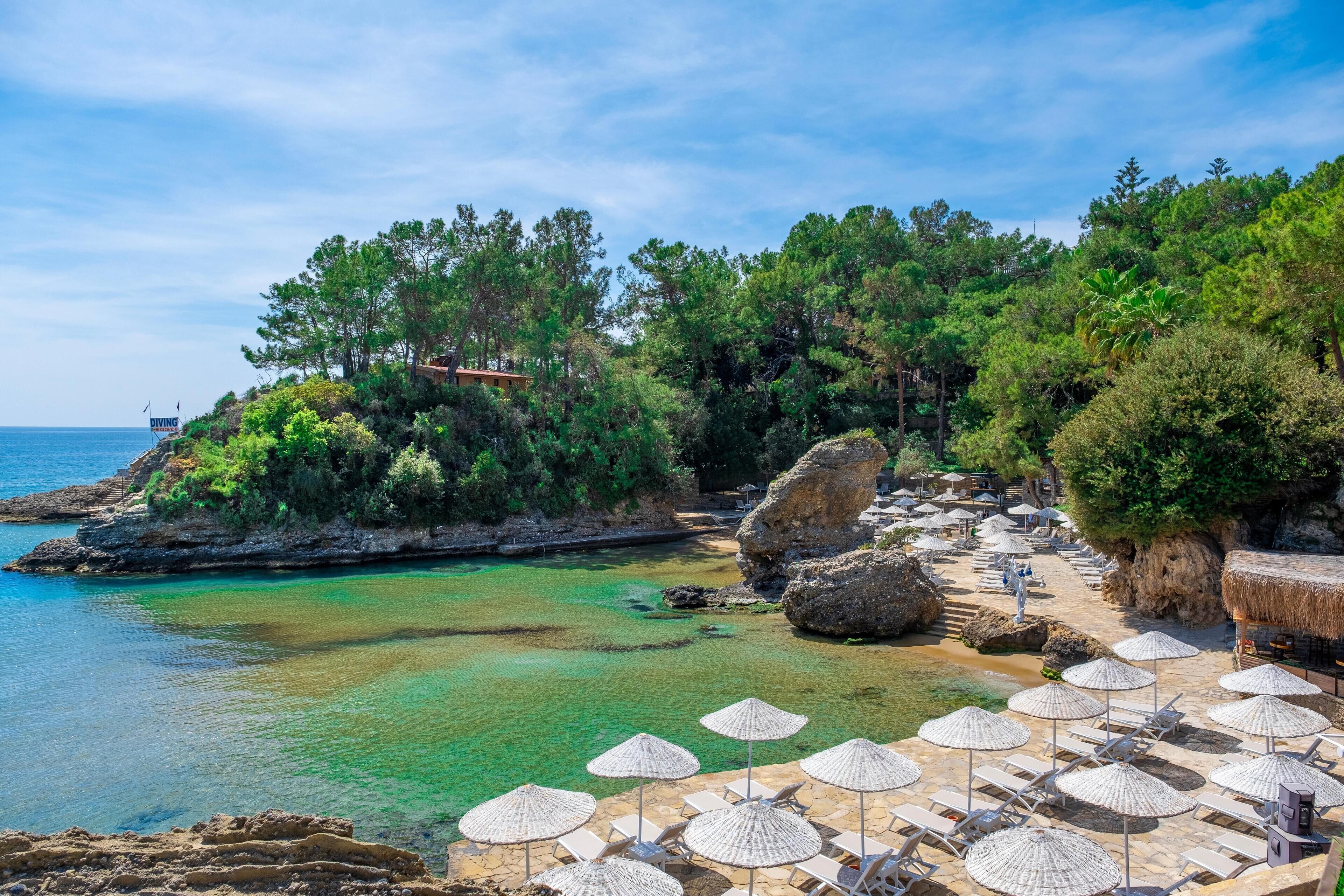 On the beach, sun-loungers, beach umbrellas, beach towels