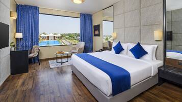 Deluxe Room, 1 King Bed, Pool View (Premium King) | In-room safe, individually furnished, laptop workspace, soundproofing