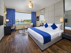 Deluxe Room, 1 King Bed, Pool View (Premium King) | 1 bedroom, in-room safe, individually furnished, laptop workspace