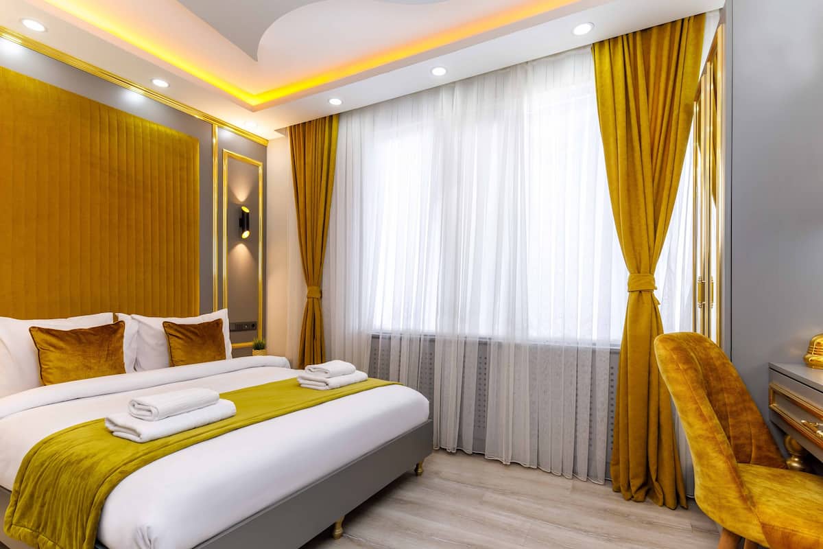 Suite superior | 1 habitación, sábanas de algodón egipcio y ropa de cama de alta calidad