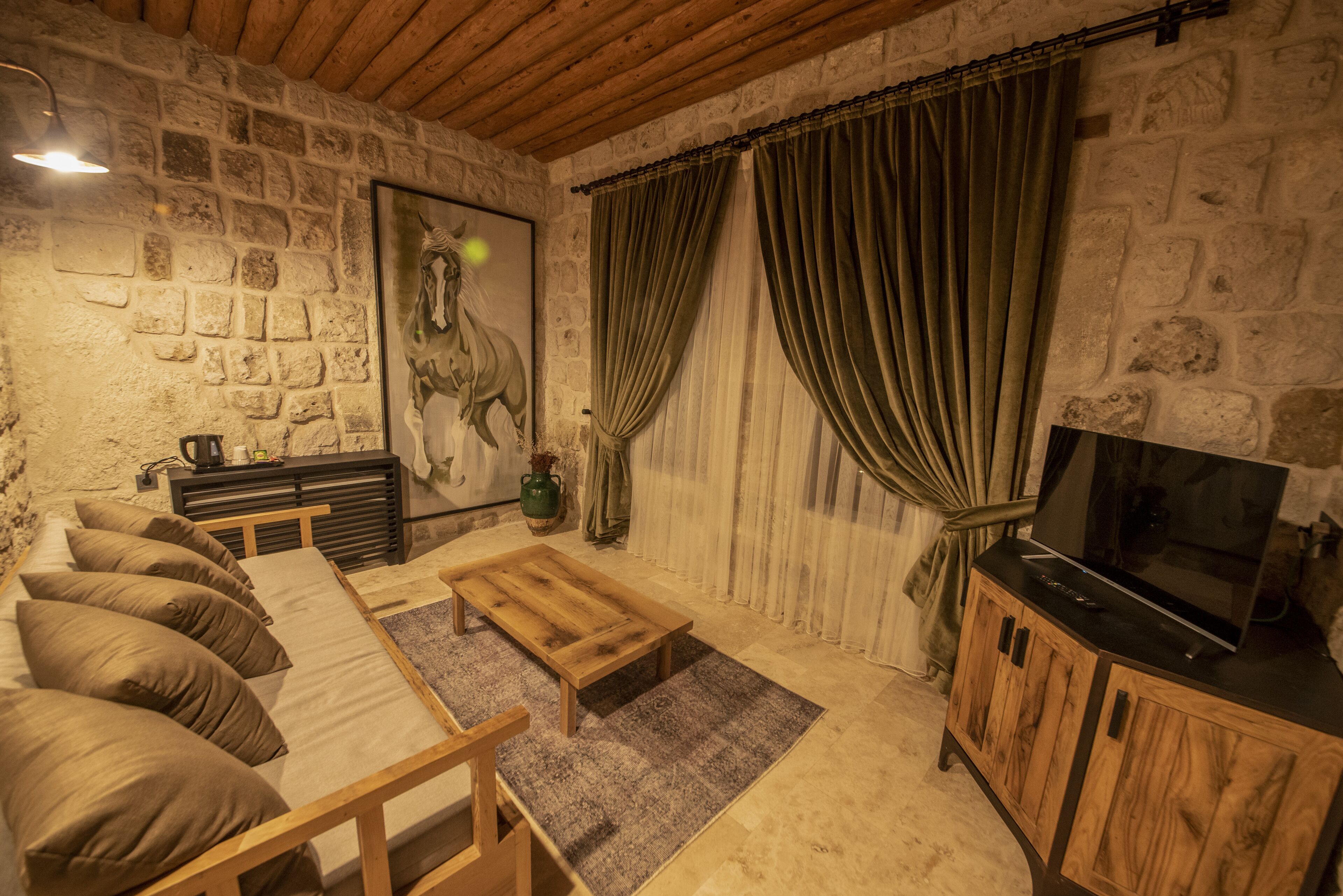 king suit with balloon view | living area | 55-inch smart tv with cable channels, tv