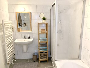 Bathtub, hair dryer, towels, soap