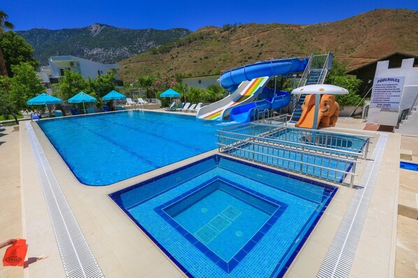 Seasonal outdoor pool, open 10:30 AM to 7:00 PM, pool umbrellas