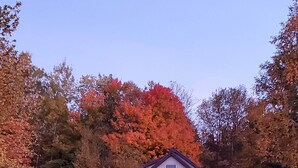 A two-story house with a front door and a small front yard. - Getaway with Snowmobile, ATV, and boating access!! (Rockwood)