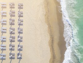 On the beach, sun loungers, beach umbrellas