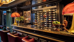 A bar area with a wine rack, seating, and decorative elements. - 100 Princes Street (Edinburgh)