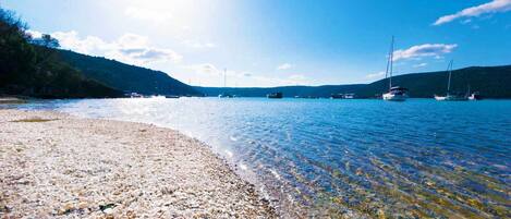 On the beach, sun-loungers