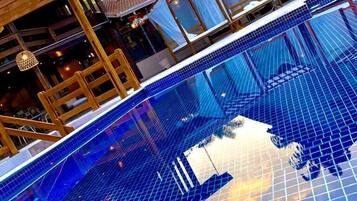 Indoor pool, outdoor pool, open 9:00 AM to 9:00 PM, pool umbrellas