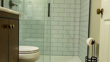 Shower, hair dryer, towels, shampoo