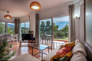 Classic Duplex | Living area | 38-inch TV with digital channels - Alterra Vita Homes by the Sea (Sithonia)