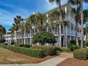 Stunning hotel with classic architecture, surrounded by lush landscaping and manicured gardens.
