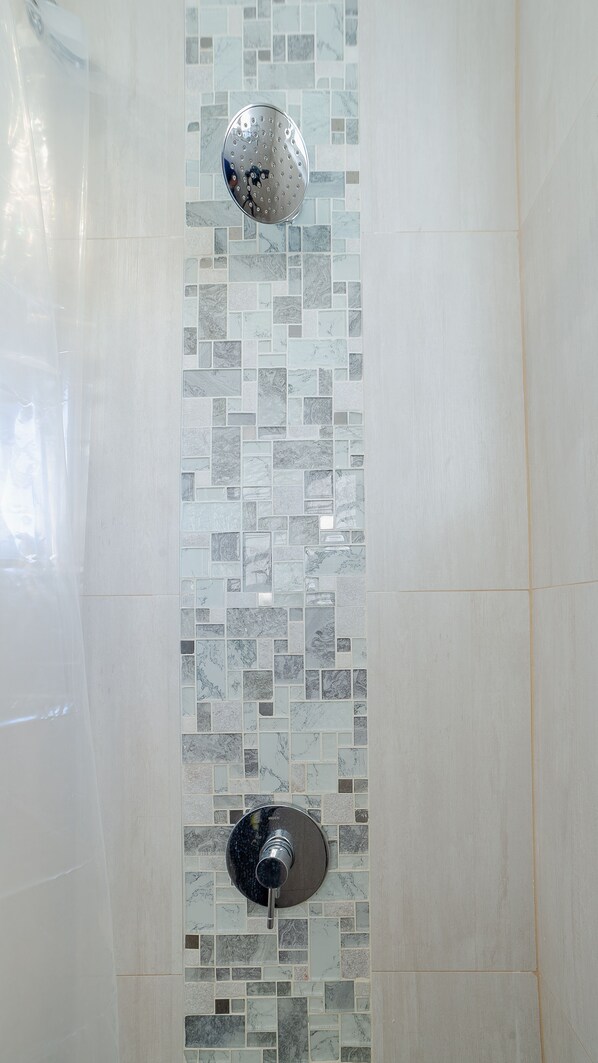 Shower, hair dryer, towels, shampoo