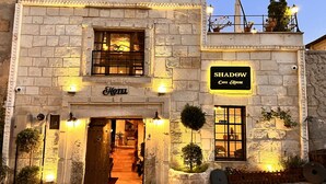 A stone building with a sign reading "Shadow Cave House Hotel". - Shadow Cave House (Ürgüp)