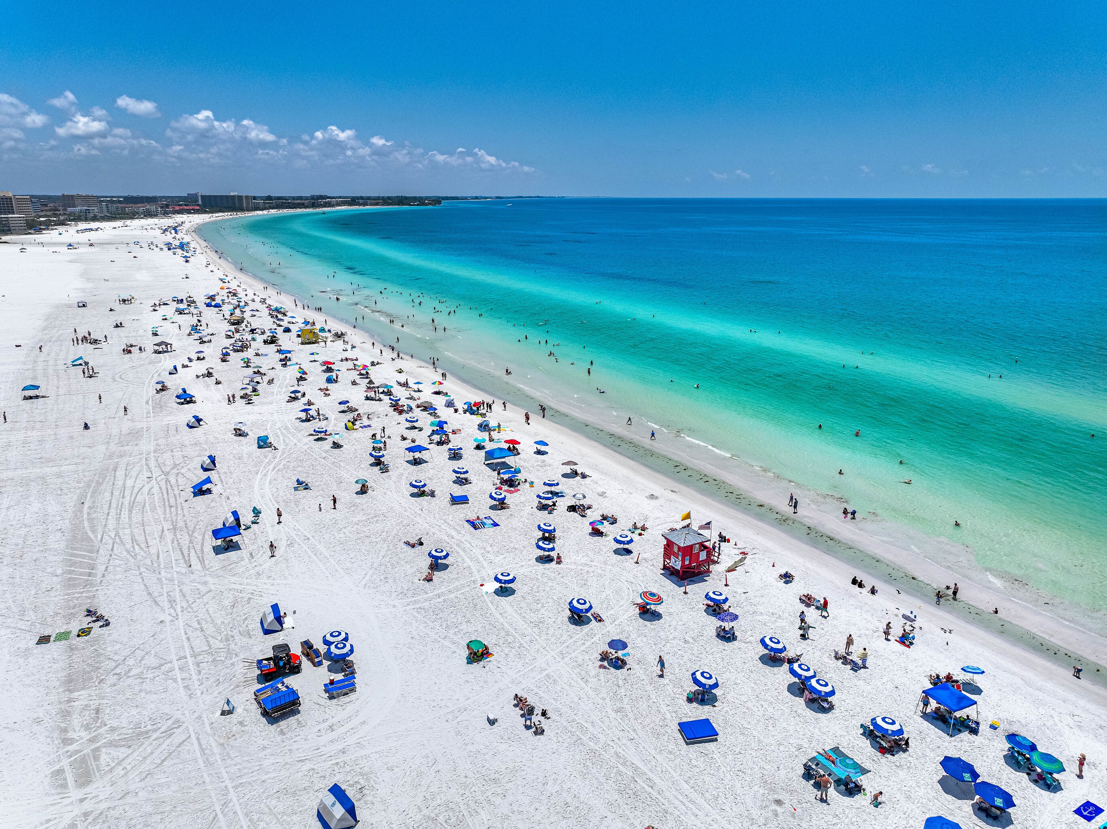 Beach nearby, white sand, beach towels