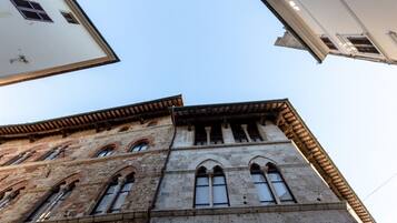 A historic building with arched windows and a stone facade.